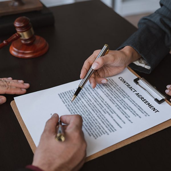 businessmen-and-lawyers-discuss-and-read-the-detai-6SW59CN